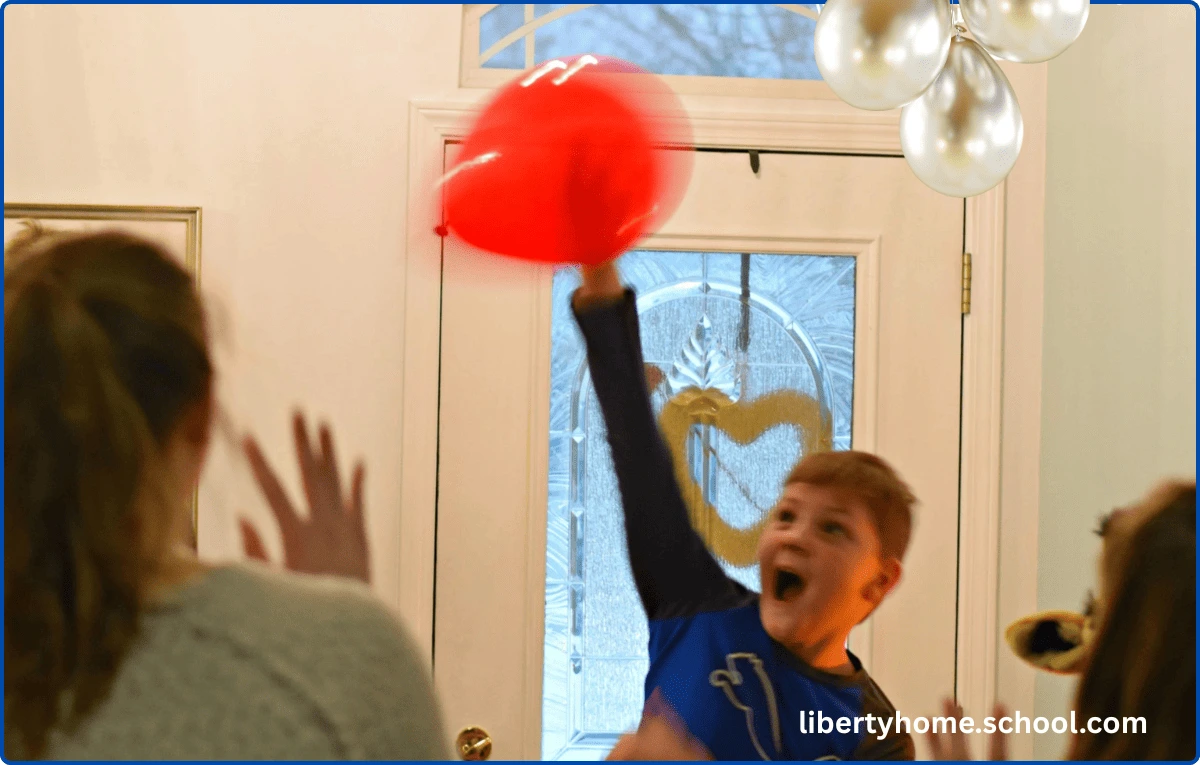 15 PE Games for 10-Year-Olds at Home 10 Children hitting a balloon over a net in a balloon volleyball game