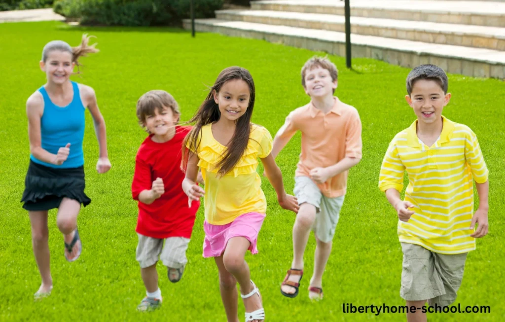 15 PE Games for 10-Year-Olds at Home 3 Children running while being chased in a Zombie Tag game on a grassy field