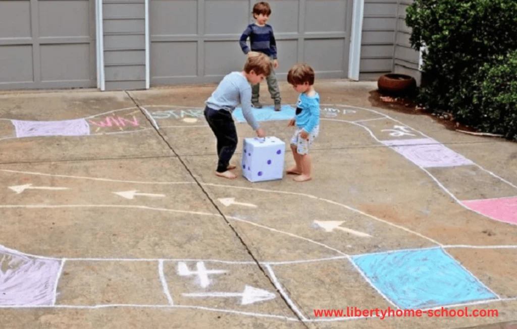 10 Summer Activities for Kids 7 Three kids watching a fun sidewalk chalk game on the pavement