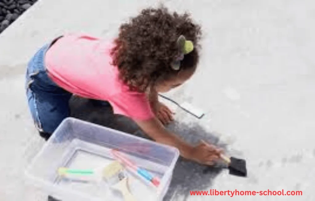 10 Summer Activities for Kids 9 Children splashing colorful paint-filled water balloons on large paper outdoors